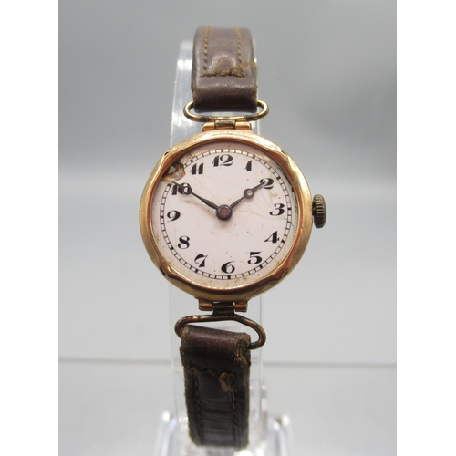 417 - Swiss ladies 9ct gold wristwatch with hinged lugs on leather strap, white enamel Arabic dial, snap o... 
