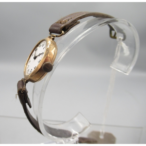 417 - Swiss ladies 9ct gold wristwatch with hinged lugs on leather strap, white enamel Arabic dial, snap o... 