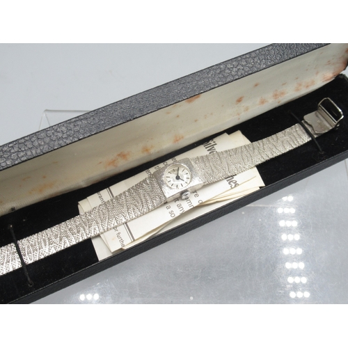 418 - Swiss Empress silver wristwatch on integrated textured bracelet, signed silver sunburst dial with ba... 