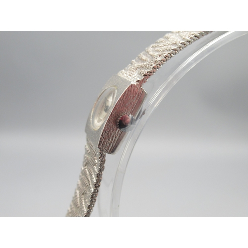 418 - Swiss Empress silver wristwatch on integrated textured bracelet, signed silver sunburst dial with ba... 