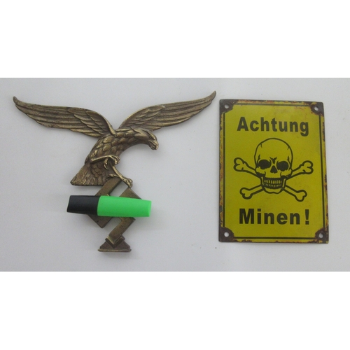 130 - Large brass Luftwaffe Eagle emblem. Wingspan 28cm x 22cm. Enamel Sign 'Achtung Minen 15cm x 20cm

Br... 