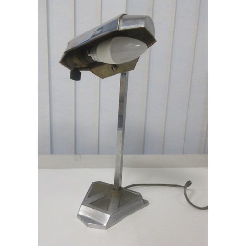 131 - Vintage Art Deco Pirouett chrome Desk Lamp circa 1930s. Hight of stand 27cm lamp shade 16cm

Bradley... 