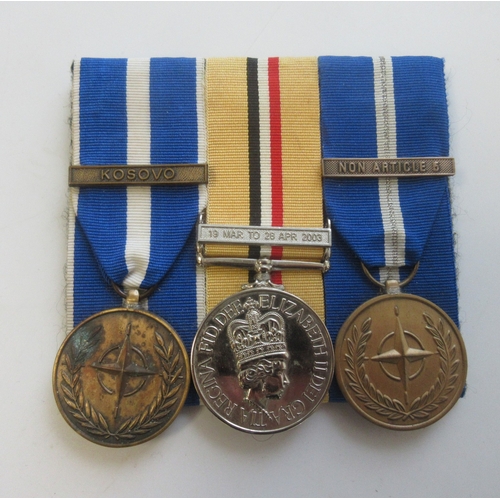 23 - Collection of Medals, miniatures, and ribbons from various conflicts. Iraq Medal with clasp, NATO Se... 