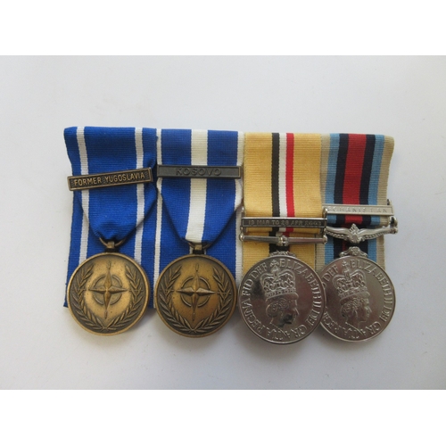 23 - Collection of Medals, miniatures, and ribbons from various conflicts. Iraq Medal with clasp, NATO Se... 