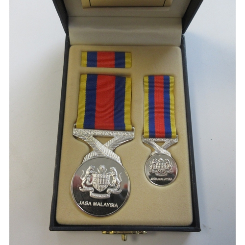 23 - Collection of Medals, miniatures, and ribbons from various conflicts. Iraq Medal with clasp, NATO Se... 