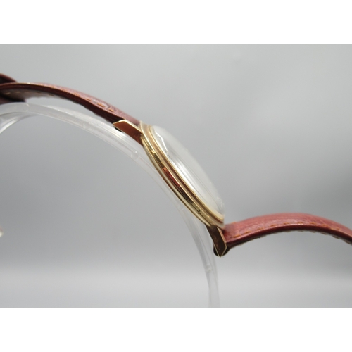 455 - Omega 9ct gold wristwatch on later leather strap with 9ct gold Omega buckle, Birmingham 1963, signed... 