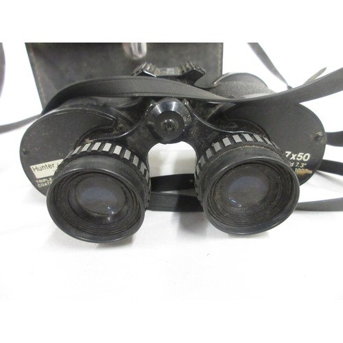 146 - Three pairs of binoculars by various manufacturers incl. Hunter 7x50, Zuiho O.I.C 10x50 (protective ... 
