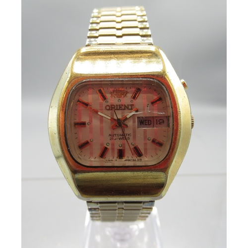 456 - Orient gold plated automatic wristwatch with day/date, signed silver striped dial with baton indices... 