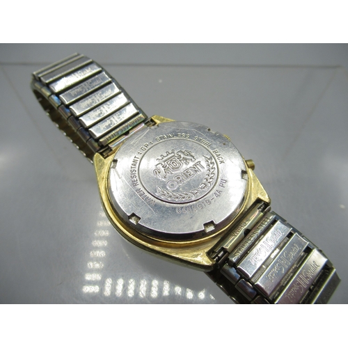 456 - Orient gold plated automatic wristwatch with day/date, signed silver striped dial with baton indices... 