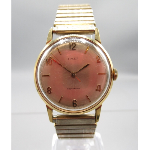 Timex gold plated wristwatch, signed gold textured dial with baton ...