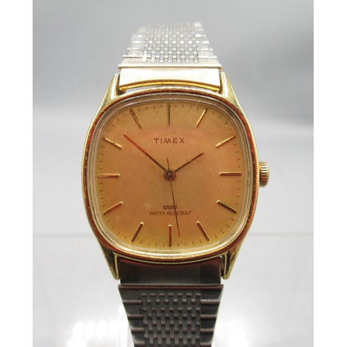 Timex gold plated wristwatch, signed gold textured dial with baton ...