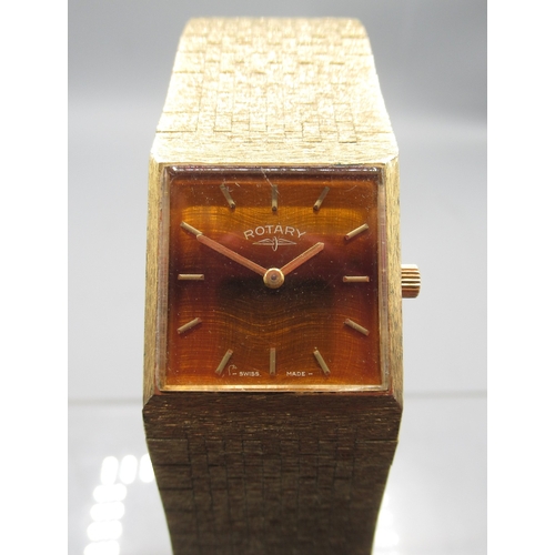 459 - Rotary gold plated wristwatch on integrated bark effect bracelet, signed Tiger's Eye dial with baton... 