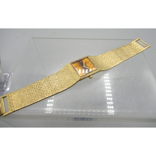 459 - Rotary gold plated wristwatch on integrated bark effect bracelet, signed Tiger's Eye dial with baton... 