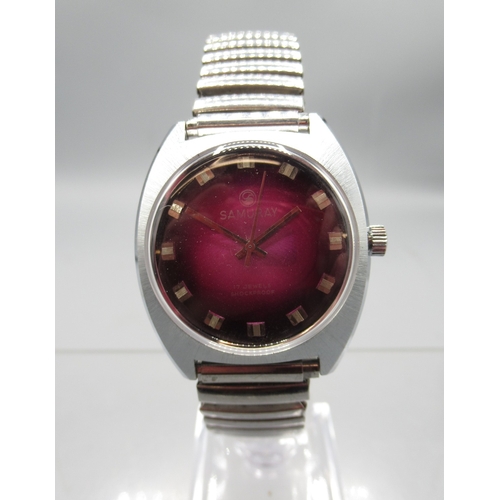 459 - Rotary gold plated wristwatch on integrated bark effect bracelet, signed Tiger's Eye dial with baton... 