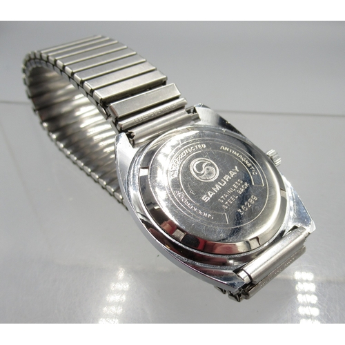 459 - Rotary gold plated wristwatch on integrated bark effect bracelet, signed Tiger's Eye dial with baton... 