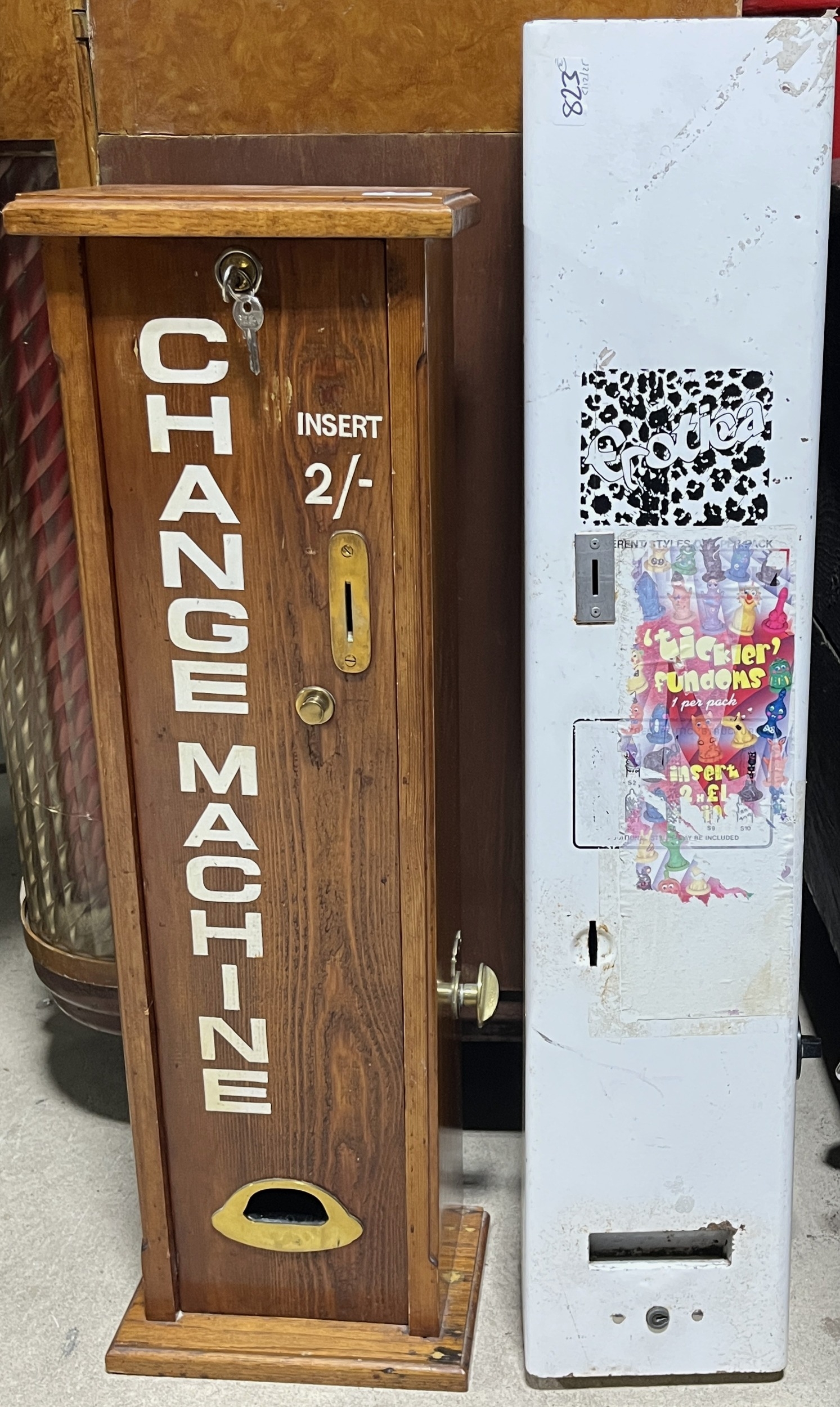 Vintage wooden wall mounted arcade change machine, and a toilet vending ...