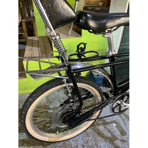 Black Raleigh Chopper style single-speed bicycle, made up of parts