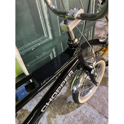 Black Raleigh Chopper style single-speed bicycle, made up of parts ...