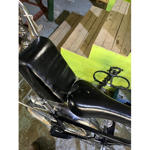 Black Raleigh Chopper style single-speed bicycle, made up of parts