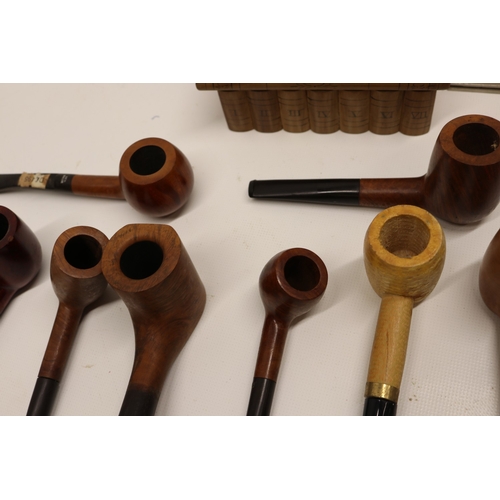 Collection of tobacco pipes with accessories comprising Dr McQuade ...