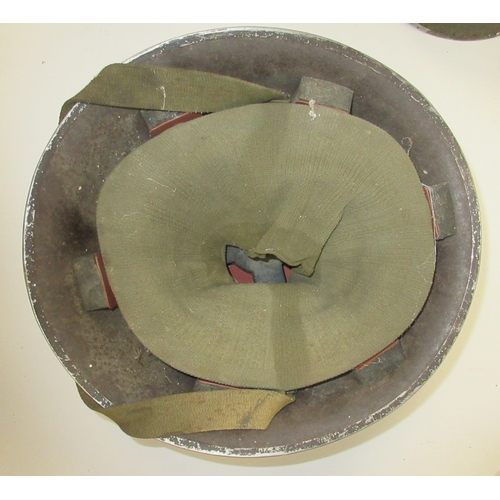 220 - British Mk5 steel helmet (The Turtle) issued from 1959, complete with original liner and elastic chi... 