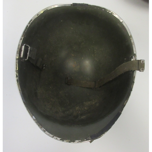 220 - British Mk5 steel helmet (The Turtle) issued from 1959, complete with original liner and elastic chi... 