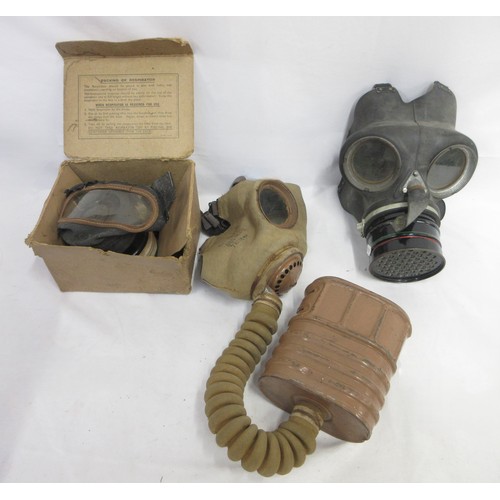 123 - Three WW2 gas masks (one civilian, one military issue, one A.R.P AF) dated 1940/1941/1942, one in or... 