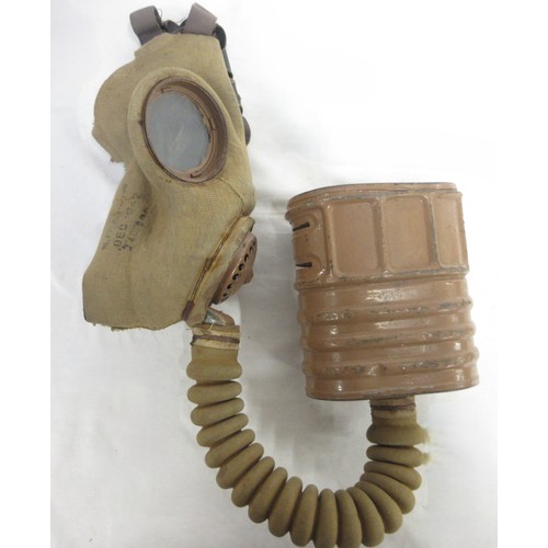 123 - Three WW2 gas masks (one civilian, one military issue, one A.R.P AF) dated 1940/1941/1942, one in or... 