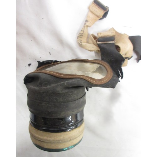 123 - Three WW2 gas masks (one civilian, one military issue, one A.R.P AF) dated 1940/1941/1942, one in or... 