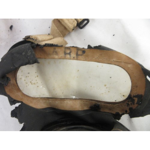 123 - Three WW2 gas masks (one civilian, one military issue, one A.R.P AF) dated 1940/1941/1942, one in or... 