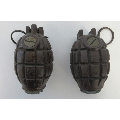 155 - Two inert WW1 British Mk1 Mills hand grenades, one with no.36 base plug (both inert, in very good co... 