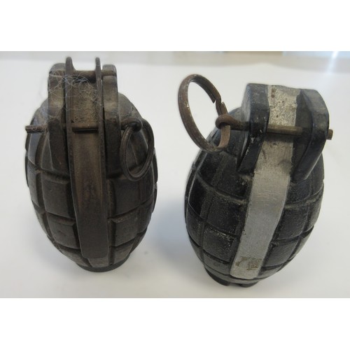 156 - Three inert hand grenades, two British Mills hand grenade one with No.51 base plug and one German st... 