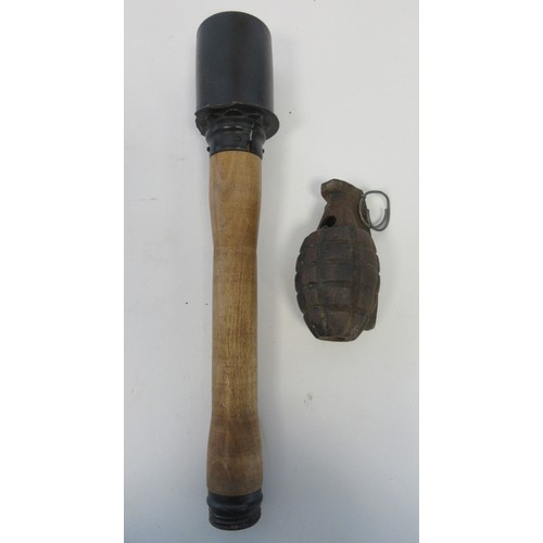 157 - One inert British Mills hand grenade (no base plug present) and one inert German stick grenade (2)

... 