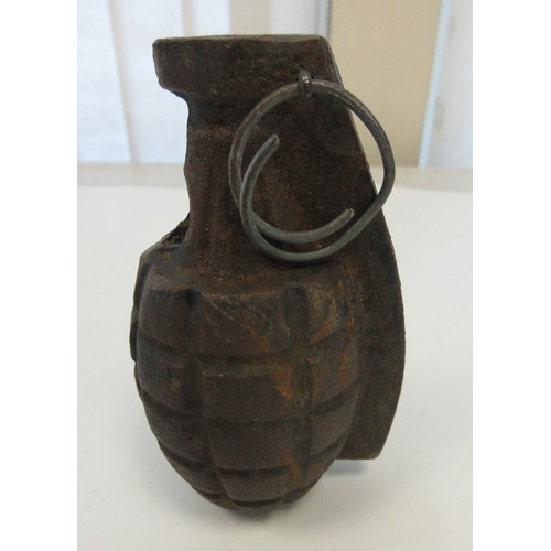 157 - One inert British Mills hand grenade (no base plug present) and one inert German stick grenade (2)

... 