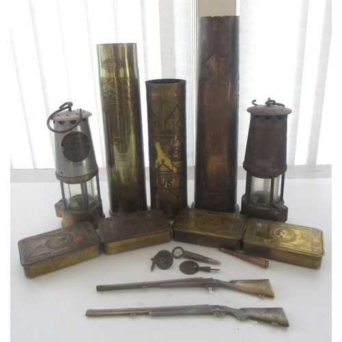 121 - Three decorative brass trench art vases, one with 'Libre' and soldier detailing, one '1918 Damascus'... 