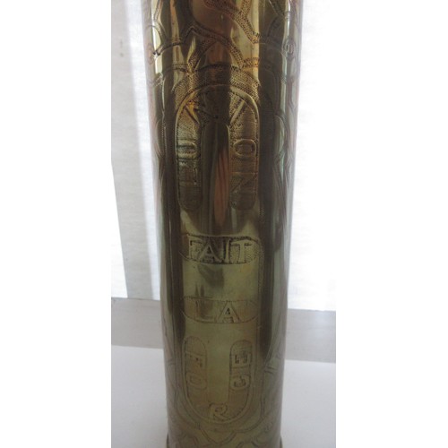 121 - Three decorative brass trench art vases, one with 'Libre' and soldier detailing, one '1918 Damascus'... 