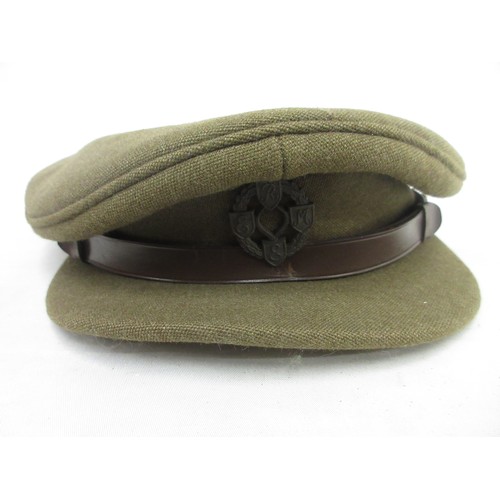 125 - Two British military caps incl. one Army officers cap with R.E.M.E cap badge made by Thomas & Stone ... 
