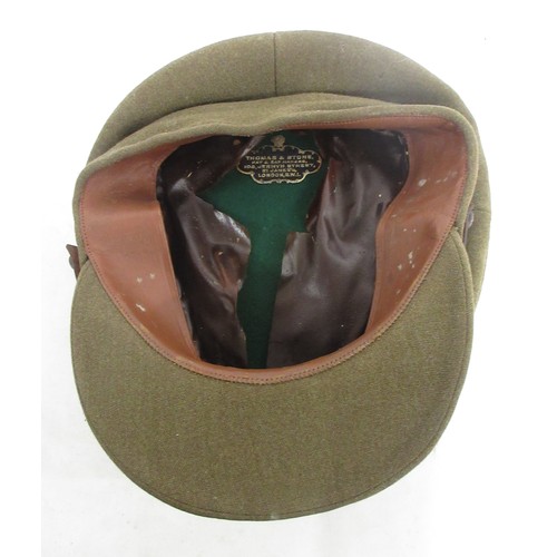 125 - Two British military caps incl. one Army officers cap with R.E.M.E cap badge made by Thomas & Stone ... 