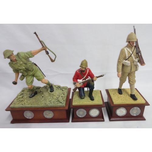 173 - Danbury Mint- Three military Danbury Mint commemorative coin display figures to incl. 'The Defence a... 