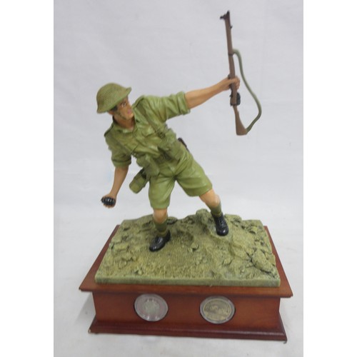 173 - Danbury Mint- Three military Danbury Mint commemorative coin display figures to incl. 'The Defence a... 