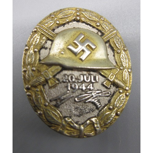 129 - German wound badge '20 July 1944' with signatures L/12 mark on back, in case

Bradleys shipping £28.... 