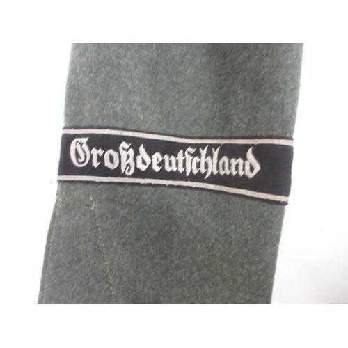 169 - German Army field blouse/tunic with cuff title and wound badge and leather belt

Bradleys shipping £... 