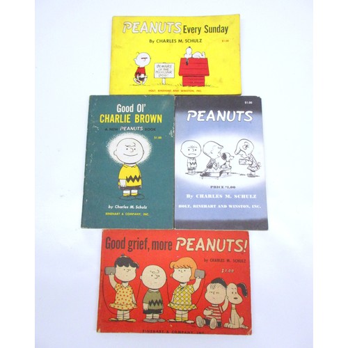 Collection of Peanuts books with poster & VHS tape, inc. number of