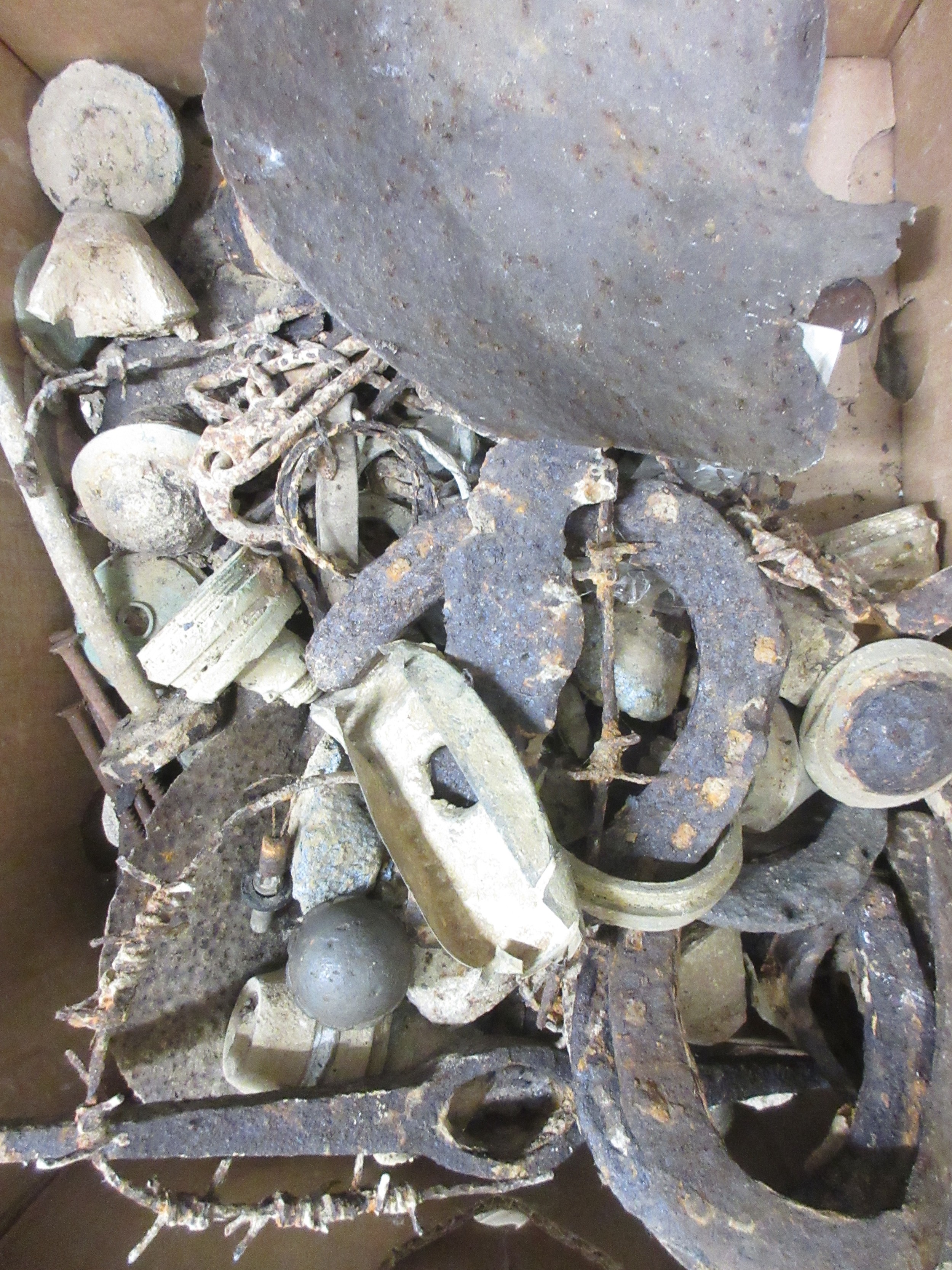 Collection of metal detecting finds incl. horse shoes, shovel head ...