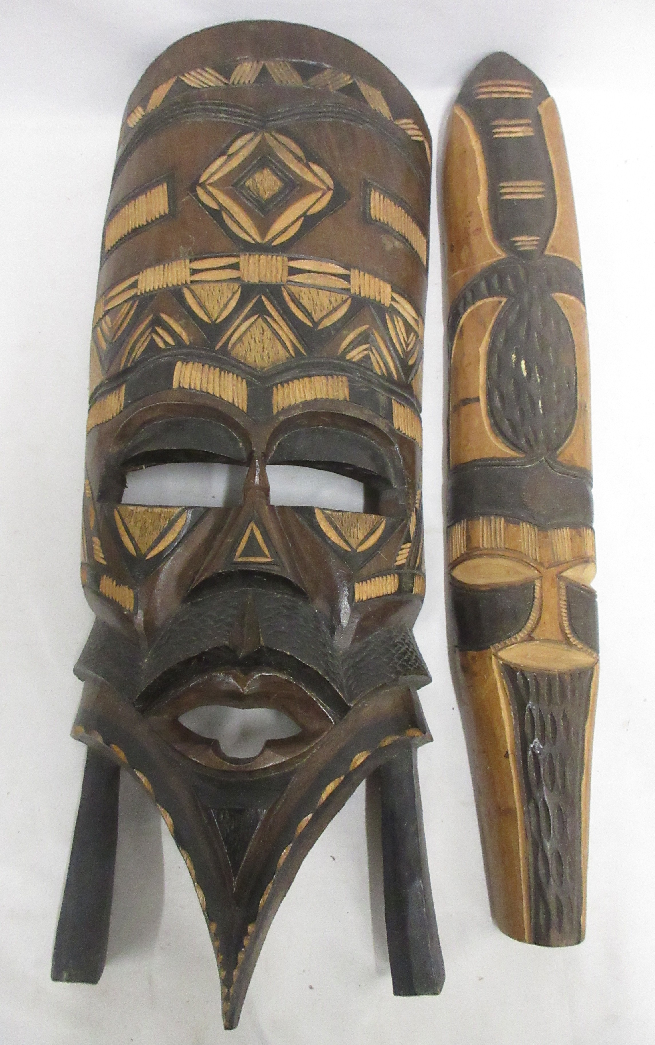 African mask, beaded horns, springbok hide, flag, and salt and pepper ...