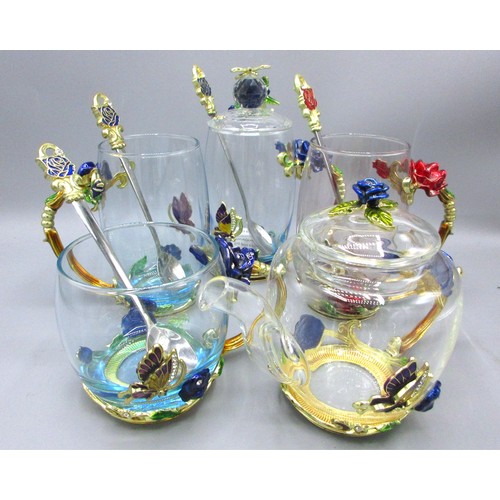 792 - Floral & butterfly-encrusted glassware comprising blooming teapot with cover, 32cl coffee mug & thre... 