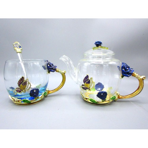 792 - Floral & butterfly-encrusted glassware comprising blooming teapot with cover, 32cl coffee mug & thre... 