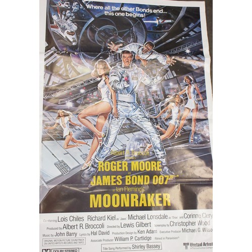 435 - James Bond memorabilia to incl. signed Roger Moore 'My Word is my Bond' book, large Moonraker film p... 