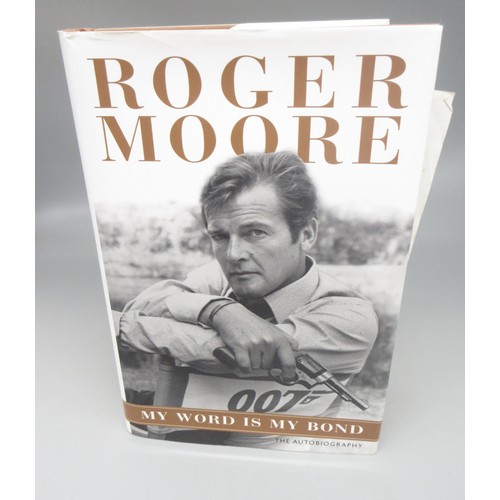 435 - James Bond memorabilia to incl. signed Roger Moore 'My Word is my Bond' book, large Moonraker film p... 
