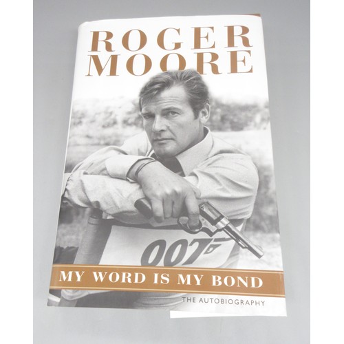 435 - James Bond memorabilia to incl. signed Roger Moore 'My Word is my Bond' book, large Moonraker film p... 